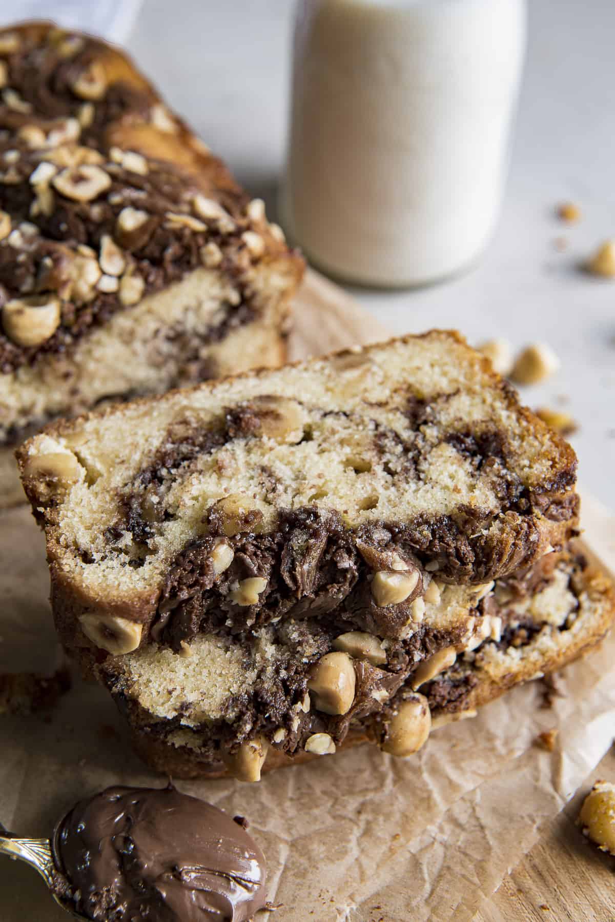 a stack of three slices of nutella bread with milk in the background