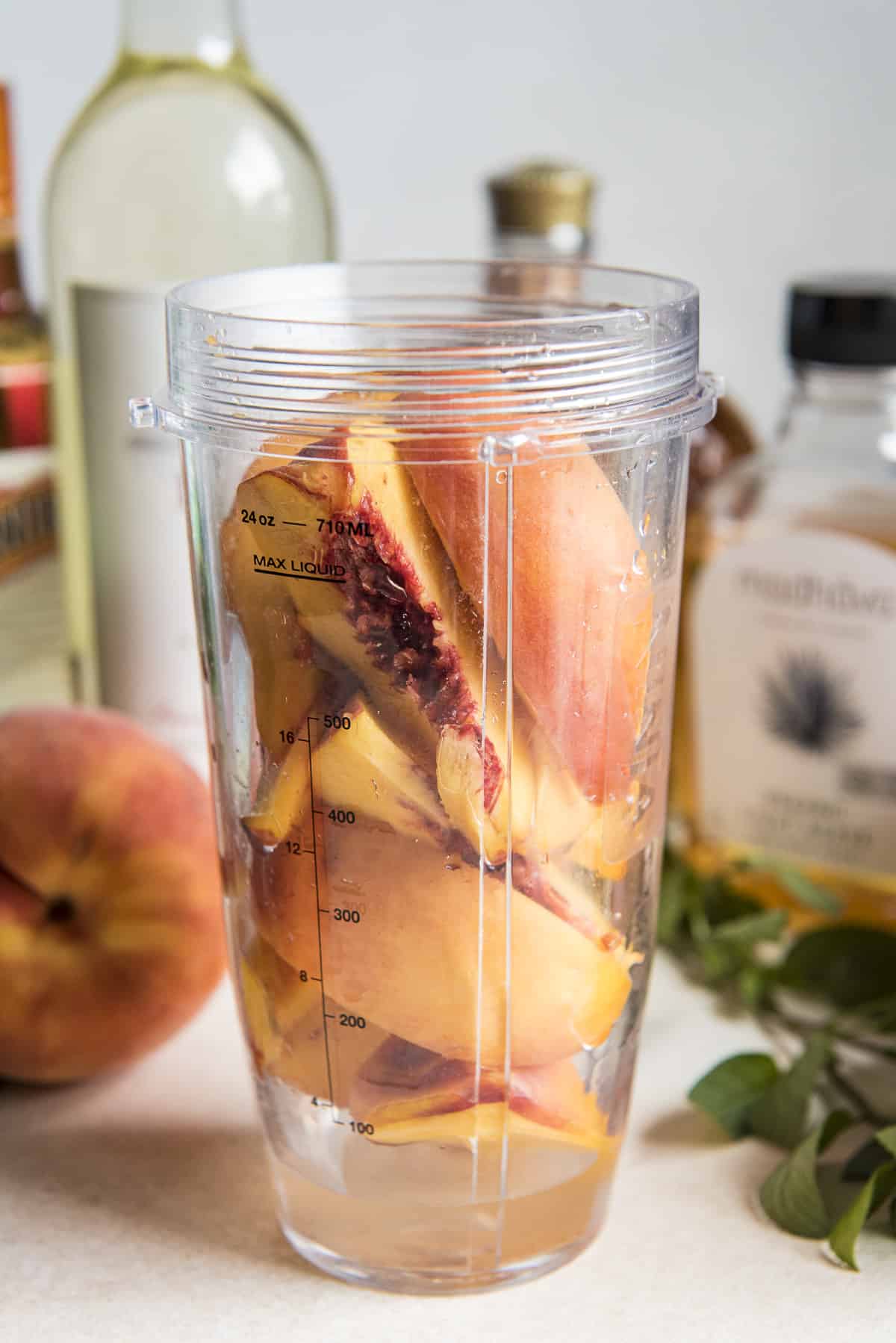 peach slices in a ninja blender bottle