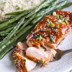 A plate of Korean salmon, green beans and rice.